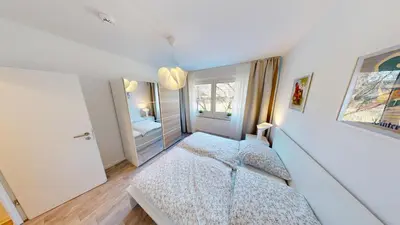 Ein Bett oder Betten in einem Zimmer der Unterkunft 5 Personen Apartment, WLAN