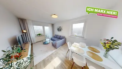 Ein Sitzbereich in der Unterkunft Lichterfülltes Apartment mit WLAN