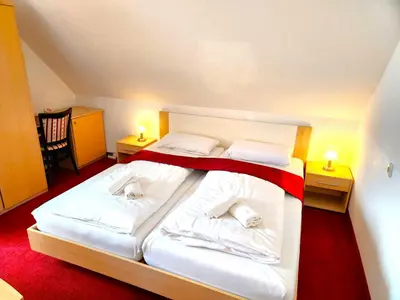 Ein Bett oder Betten in einem Zimmer der Unterkunft Pension Blümchen am Kiesgrube