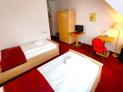 Ein Bett oder Betten in einem Zimmer der Unterkunft Pension Blümchen am Kiesgrube