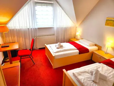 Ein Bett oder Betten in einem Zimmer der Unterkunft Pension Blümchen am Kiesgrube