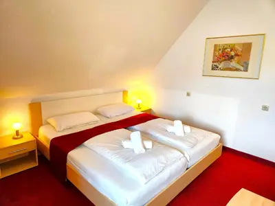Ein Bett oder Betten in einem Zimmer der Unterkunft Pension Blümchen am Kiesgrube