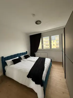 Ein Bett oder Betten in einem Zimmer der Unterkunft Ferienwohnung Rida - Stilvoll übernachten