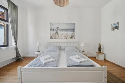 Ein Bett oder Betten in einem Zimmer der Unterkunft Ocean Breeze Residence - Nahe Uni & Zentrum
