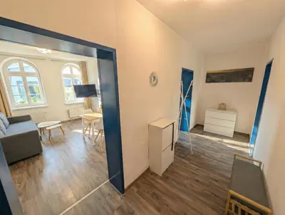 Ein Bett oder Betten in einem Zimmer der Unterkunft F1B - Urlaubsmagie - Helle Wohnung mit Sauna und Pool