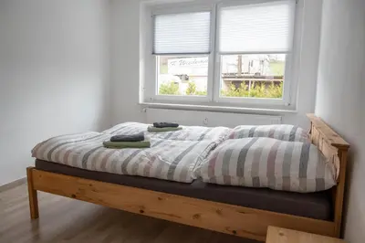 Ein Bett oder Betten in einem Zimmer der Unterkunft Ferienwohnung zum Schlossblick