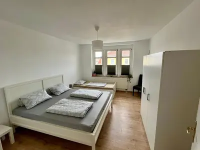 Ein Bett oder Betten in einem Zimmer der Unterkunft Ferienwohnung für 5 Personen