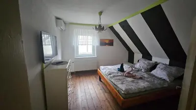 Ein Bett oder Betten in einem Zimmer der Unterkunft Zur Alten Post