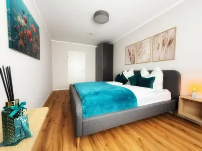 Ein Bett oder Betten in einem Zimmer der Unterkunft Carrée 31 Balkon, Privatparkplatz, Aufzug, Kaffee