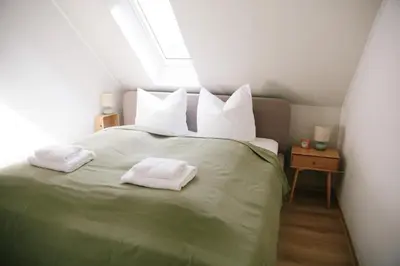 Ein Bett oder Betten in einem Zimmer der Unterkunft stay-a-while Apartment I Hannah I WLAN, kostenloser Parkplatz