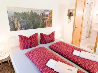 Ein Bett oder Betten in einem Zimmer der Unterkunft L4 - Urlaubsmagie - Kleine Wohnung am Wanderweg