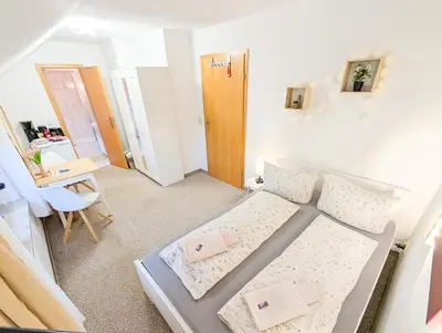 Ein Bett oder Betten in einem Zimmer der Unterkunft L7 - Urlaubsmagie - Kleine Wohnung am Wanderweg