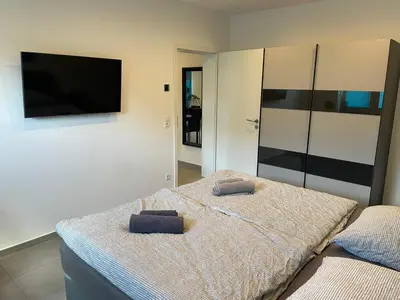 Ein Bett oder Betten in einem Zimmer der Unterkunft Großkoschen Wohnungen