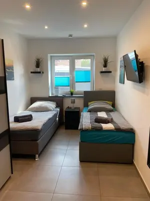 Ein Bett oder Betten in einem Zimmer der Unterkunft Großkoschen Wohnungen