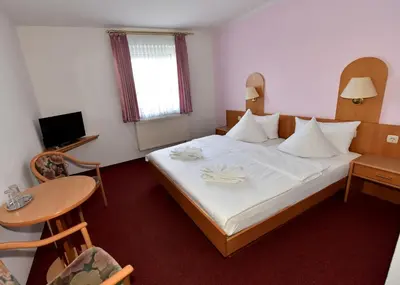 Ein Bett oder Betten in einem Zimmer der Unterkunft Pension Schwesinger