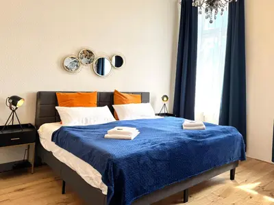 Ein Bett oder Betten in einem Zimmer der Unterkunft NewCityHome - Chemnitz - 2 Zi - Design Apartment Naomi - Kaßberg - Private Parking