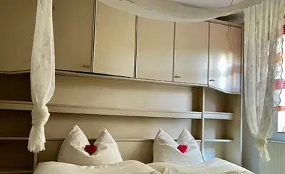 Ein Bett oder Betten in einem Zimmer der Unterkunft Villa L & S - Gemütliche Ferienwohnung im Grünen bei Dresden