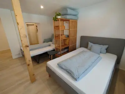 Ein Bett oder Betten in einem Zimmer der Unterkunft Angernest, Ferienwohnung in Kamenz