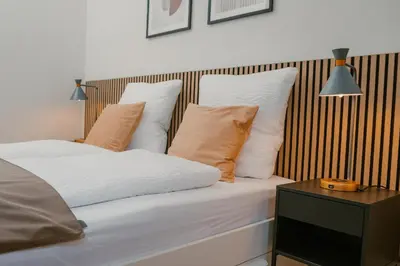 Ein Bett oder Betten in einem Zimmer der Unterkunft JINO Dresden I Zentrumsnah - WLAN - Küche