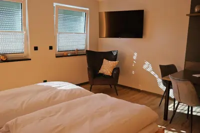 Ein Bett oder Betten in einem Zimmer der Unterkunft Ferienwohnungen FRENZELHOF ZUM KONJECHT