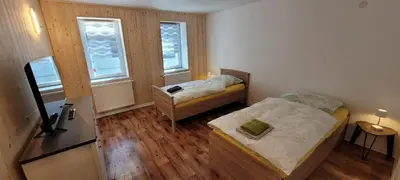 Ein Bett oder Betten in einem Zimmer der Unterkunft Seyfarthrooms - Monteurwohnung Großröhrsdorf 3 - zentrale Lage, gute Anbindung, ideal für 2 Personen