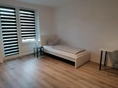 Ein Bett oder Betten in einem Zimmer der Unterkunft Wohnung I Monteur I WiFi