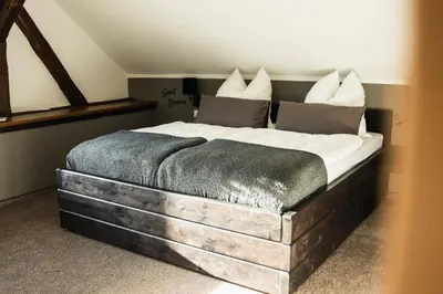 Ein Bett oder Betten in einem Zimmer der Unterkunft Ferienhaus zum Johannisthal