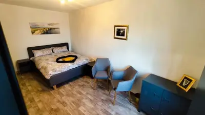 Ein Bett oder Betten in einem Zimmer der Unterkunft Golden Hop Apartments