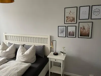 Ein Bett oder Betten in einem Zimmer der Unterkunft Charming 4-Person Apartment in Hoyerswerda City Center
