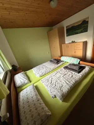 Ein Bett oder Betten in einem Zimmer der Unterkunft Ferienwohnung Am Lilienstein