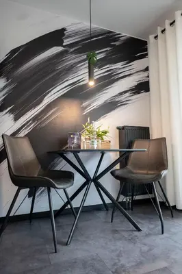 Ein Sitzbereich in der Unterkunft Black & White Apartment - Balkon, Netflix, Nespresso, Zentral, Messe