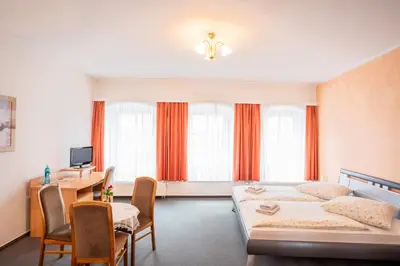 Ein Bett oder Betten in einem Zimmer der Unterkunft Hotel Bavaria