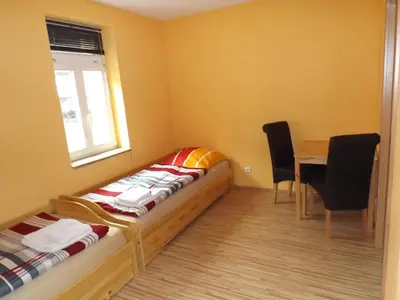 Ein Bett oder Betten in einem Zimmer der Unterkunft Pension Rego
