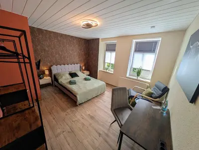 Ein Bett oder Betten in einem Zimmer der Unterkunft Komfortzimmer Waldheim