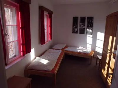Ein Bett oder Betten in einem Zimmer der Unterkunft Herberge Burg Hohnstein