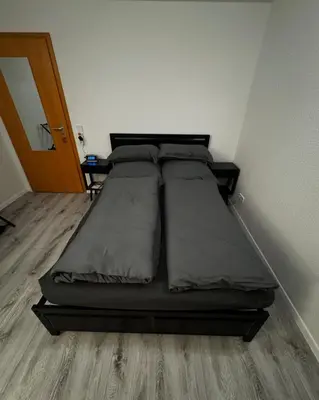 Ein Bett oder Betten in einem Zimmer der Unterkunft The Black Room
