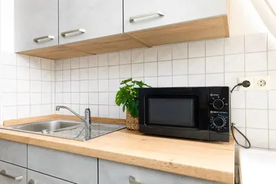 Küche/Küchenzeile in der Unterkunft StayTime - Oak Loft