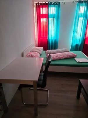 Ein Bett oder Betten in einem Zimmer der Unterkunft Apart Konkordia