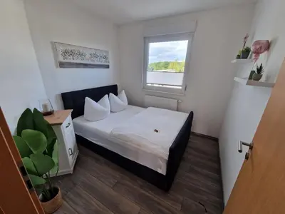 Ein Bett oder Betten in einem Zimmer der Unterkunft Komfortable Ferienwohnung in Hainichen