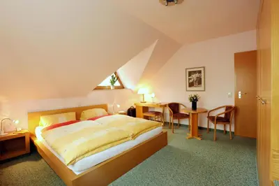 Ein Bett oder Betten in einem Zimmer der Unterkunft Ferienwohnung Prasser