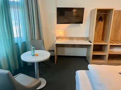 TV/Unterhaltungsangebot in der Unterkunft DH Hotel Deutsches Haus Mittweida - Ihr digitales Hotel