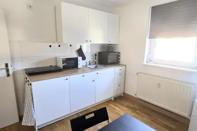 Küche/Küchenzeile in der Unterkunft L21-Apartment Ottendorf-Okrilla, 1 Zimmer, 3 Betten, Standardisierte Ausstattung, ideal für Reisende, Pendler, Familien