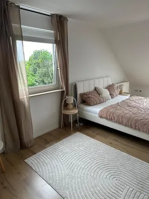 Ein Bett oder Betten in einem Zimmer der Unterkunft Ferienhaus Dresdener Ausblick