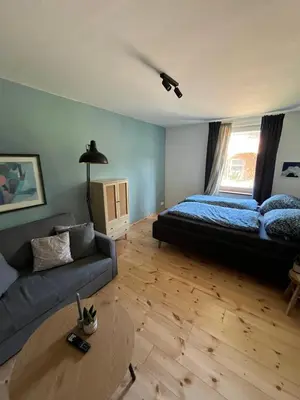 Ein Bett oder Betten in einem Zimmer der Unterkunft Rosa,s Garten