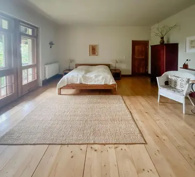 Ein Bett oder Betten in einem Zimmer der Unterkunft Historic Villa Apartment In Nature Reserve