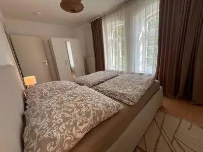 Ein Bett oder Betten in einem Zimmer der Unterkunft Sächsische Siesta Apartment