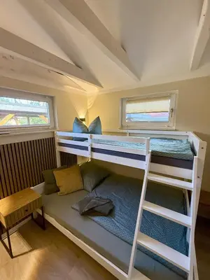 Ein Bett oder Betten in einem Zimmer der Unterkunft Ferienhaus am See