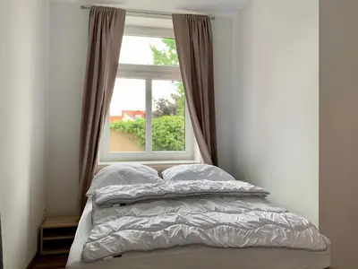 Ein Bett oder Betten in einem Zimmer der Unterkunft Moderne Ferienwohnung im Zentrum von Grimma