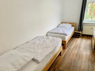 Ein Bett oder Betten in einem Zimmer der Unterkunft Moderne Ferienwohnung im Zentrum von Grimma
