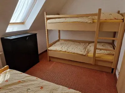 Ein Bett oder Betten in einem Zimmer der Unterkunft FEWO Torfhaus Holzhau